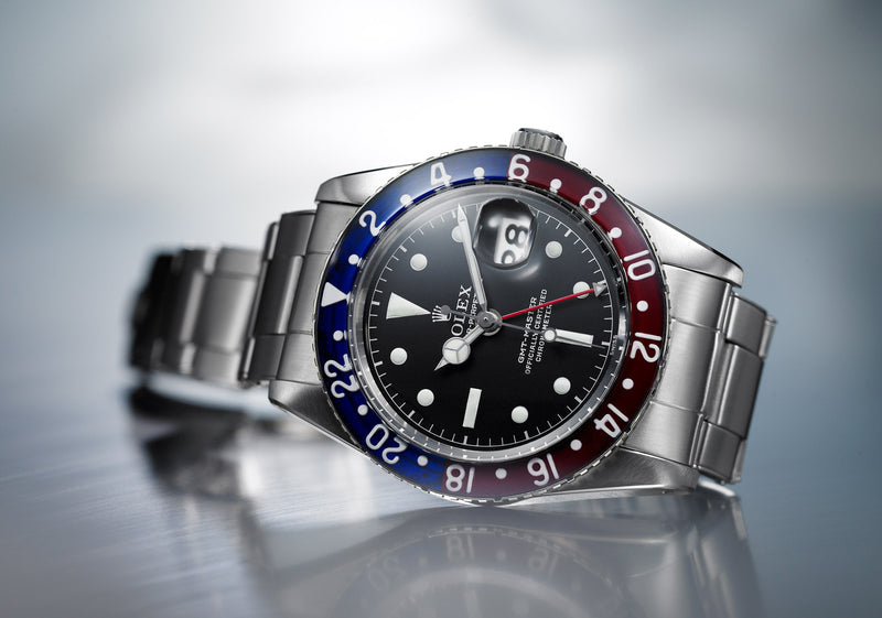 A vintage Rolex GMT Master II with the iconic red and blue bezel insert. Date feature at 3 o'clock. Model #6542.