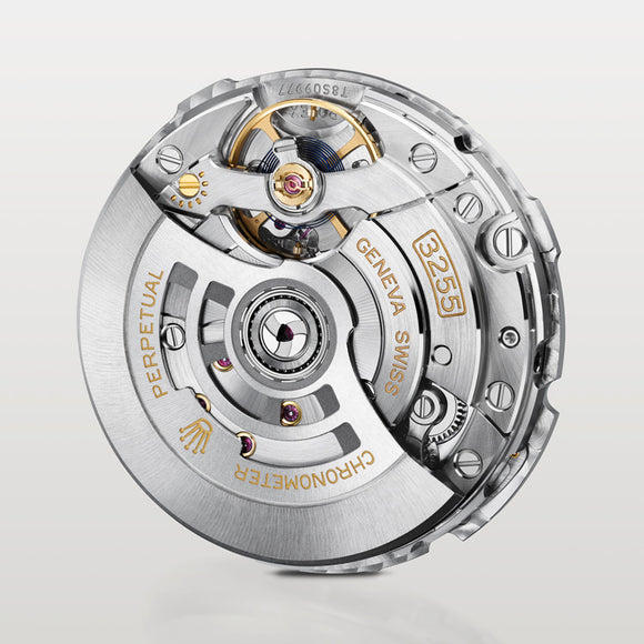 Rolex movement calibre 3255 that is found in the Oyster Perpetual Day-Date collection, out of the case. The movement is standing up and you can see details of its finishing.