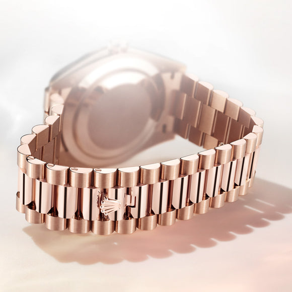 The Rolex president bracelet in 18K Everose gold. Displaying the hidden clasp that is only found using the Rolex crown.