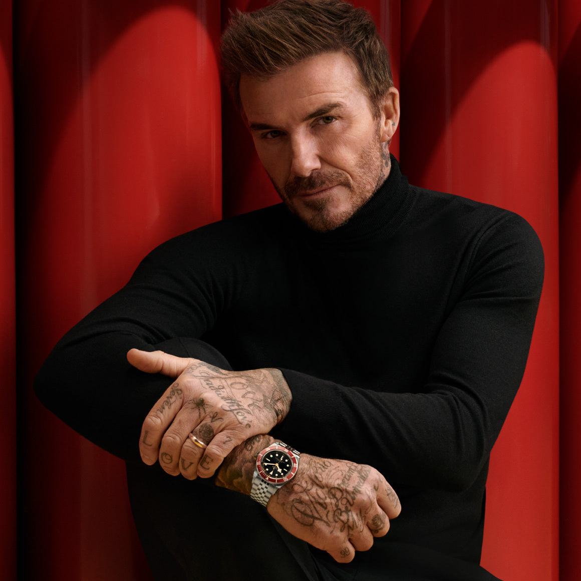 David Beckham posing with a Tudor Black Bay 41 on his wrist.