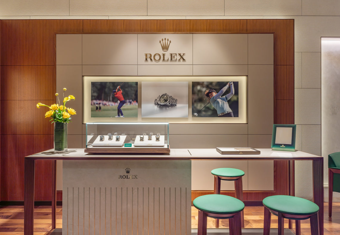 A direct shot of our Rolex shop-in-shop featuring our Rolex display case and sit down counter.