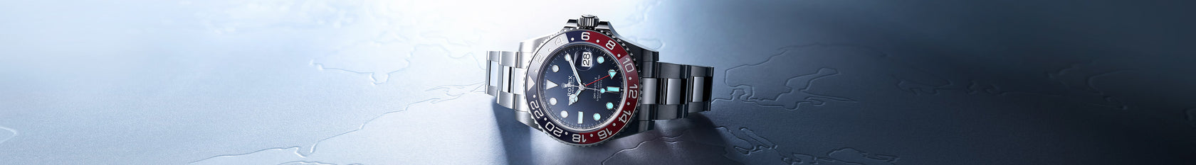 The Rolex GMT Master II in 18K white gold and a blue dial. This watch features a blue and red creamic disc for the bezel and the date feature at 3 o'clock. Model #126719BLRO.