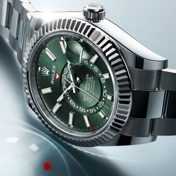 The Rolex Sky-Dweller in Oystersteel on an Oyster bracelet. Fluted bezel made of 18K white gold. Featuring a green dial. Ref #M336934-0001.