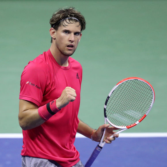 Rolex testimonee Dominic Thiem giving a fist pump on the courts of the US Open of tennis.