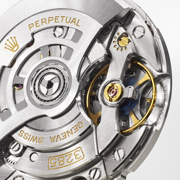 A detailed photograph of the Rolex movement calibre 3285, the machine inside the Rolex GMT-Master II.