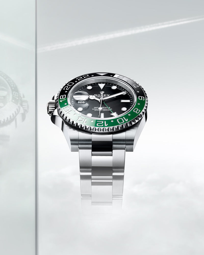 The 2022 introduction of the GMT Master II with the crown on the left side of the case. The date is also at the 9 o'clock position, and the bezel is made from green and black ceramic. Model #126720VTNR.