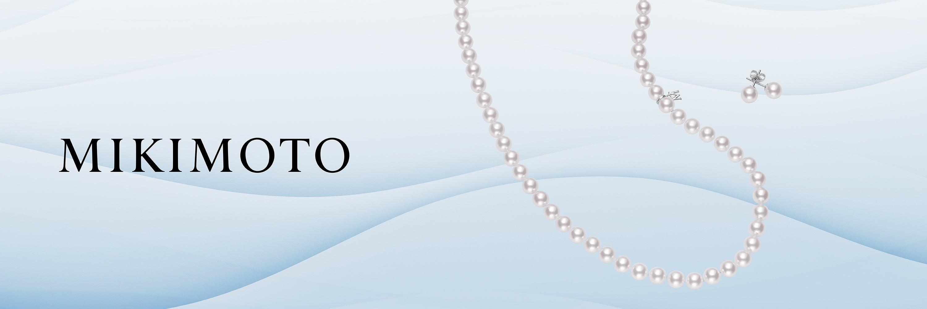 Mikimoto pearl necklace and earrings on a wavy background with the Mikimoto logo.